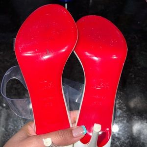 Just nothing Christian Louboutin slide sandal in clear PVC and patent leather.